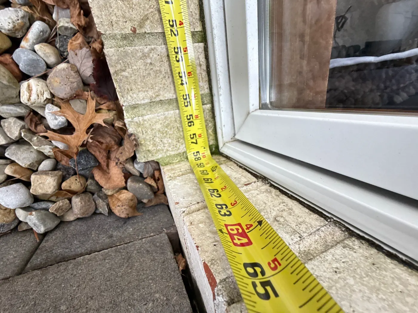 Storm-damaged window documented in Allisonville